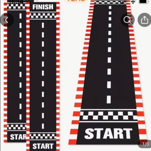 Party supplies set with road carpet, cones, flags, and accessories