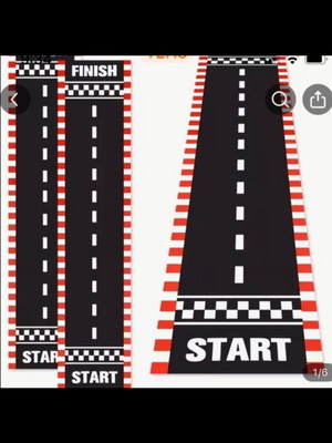 Party supplies set with road carpet, cones, flags, and accessories