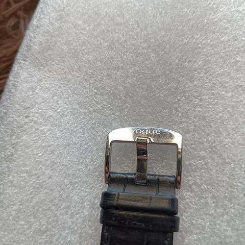 Vogue watch used with white dial and black leather strap