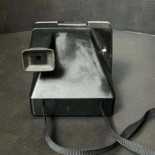 Vintage Polaroid One Step SX-70 camera and film used, white with rainbow stripe