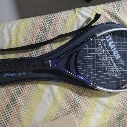 Tennis racket used with cover
