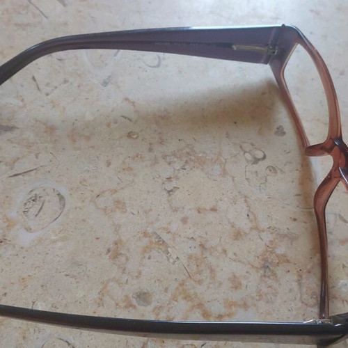 Miu Miu eyeglasses used with purple and orange acetate frame