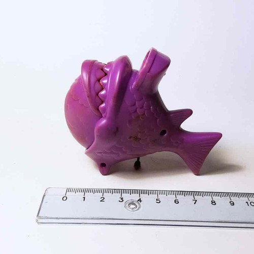 Plastic toy purple fish used with closing mouth