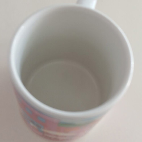 Porcelain mug like new with pink design