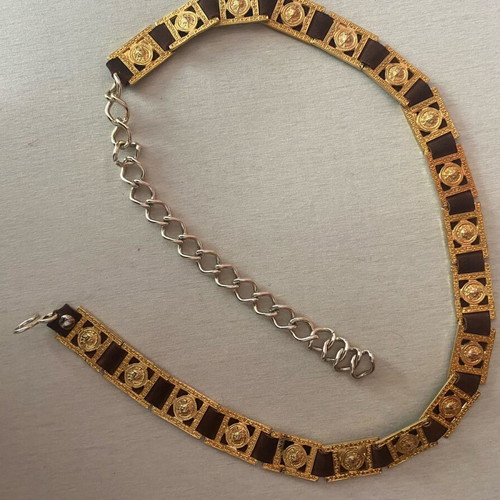 Belt with golden metal details on brown leather, like new