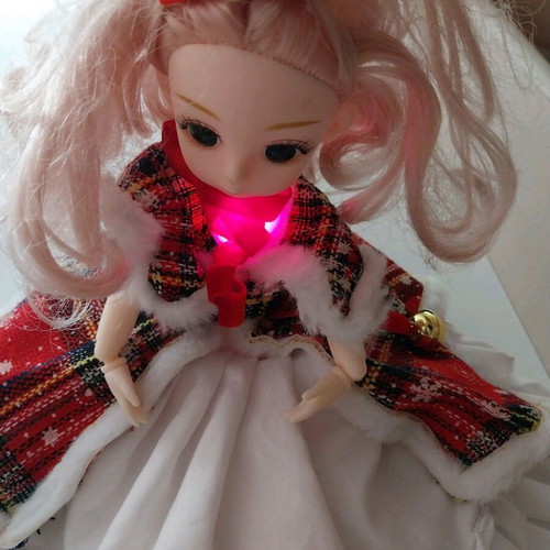 Music doll like new with Christmas outfit and keychain