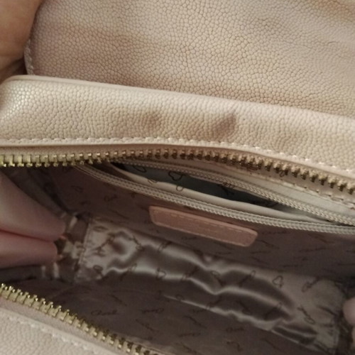 Axel pink shoulder bag used with gold details