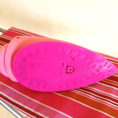 Toy ironing board with light-up iron that plays music like new