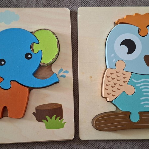 Wooden puzzles for children used, owl and elephant