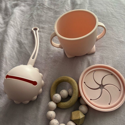 Baby silicone teething set, pacifier holder and training cup used