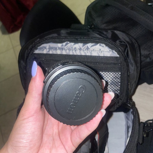 Canon EOS 1200D camera kit with lenses, memory card, battery, charger, and carrying bag