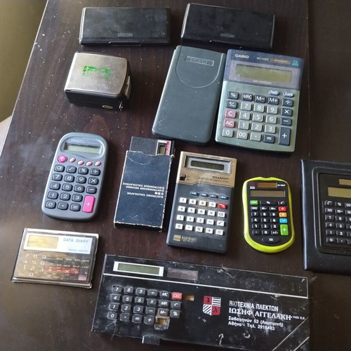 Vintage calculators and electronic organizers used, pack of 12