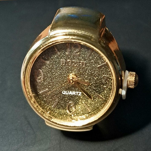 Ring watch quartz with khaki dial and gold bracelet like new