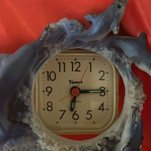 Clock used with dolphins around