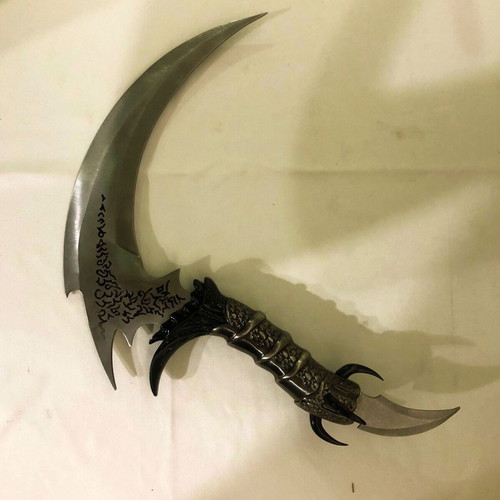 Decorative stainless steel knife with stand like new
