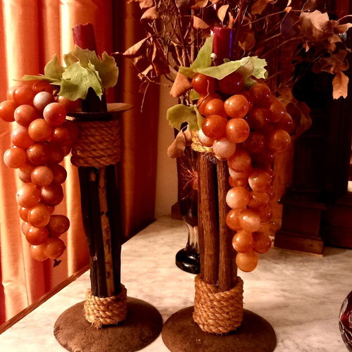 Handmade candlesticks used, set made of branches, rope and metal