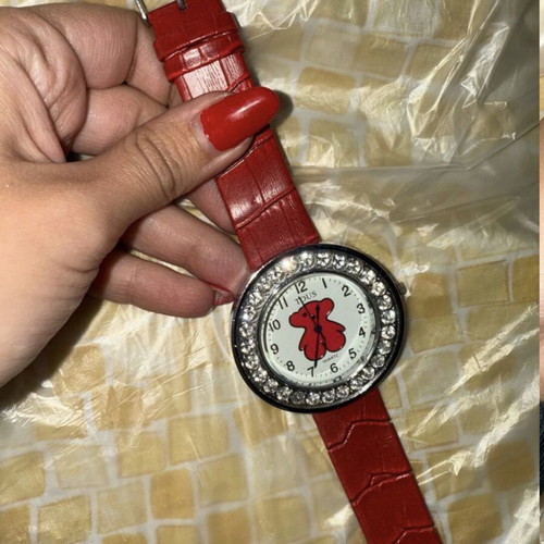 Red wristwatch authentic, needs battery