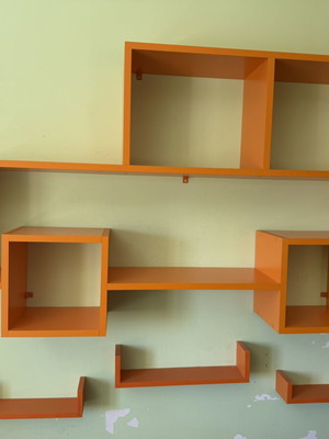Modern orange wall shelf unit for kids or office