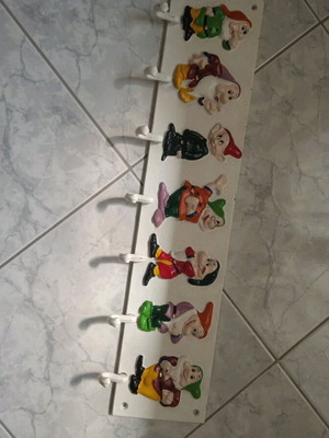 Vintage wall hanger with seven dwarfs used, heavy iron construction