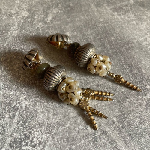 Gold dangling earrings used, missing some dangles