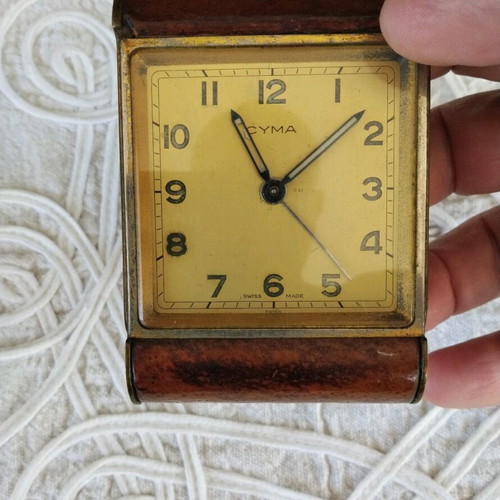 Cyma table clock used, Swiss made, brass with leather