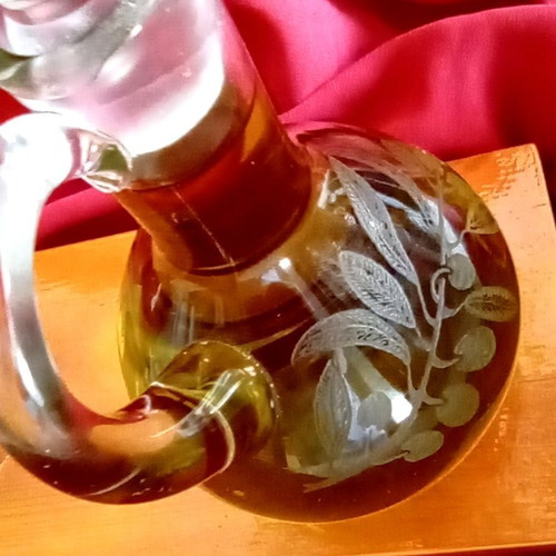Handmade oil and vinegar set with carved glass bottles and wooden base