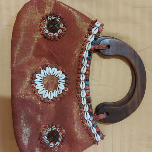 Handmade summer handbag in like new condition with shells and wooden handle orange