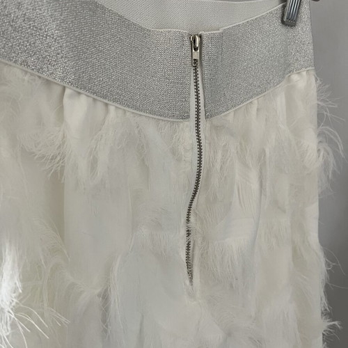 White maxi skirt with feathers and silver waistband
