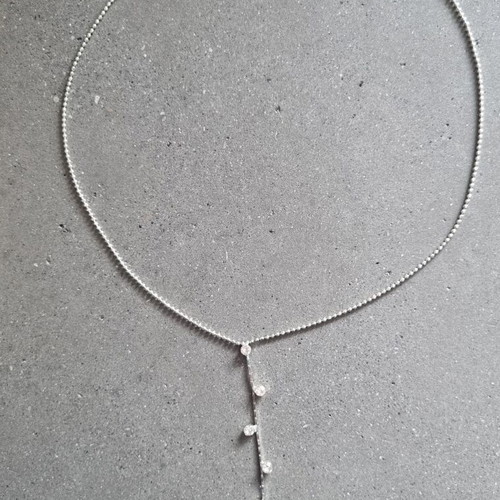 Necklace with hanging chain and stones