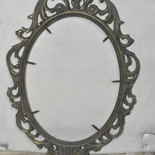 Brass oval frame used with embossed vintage design