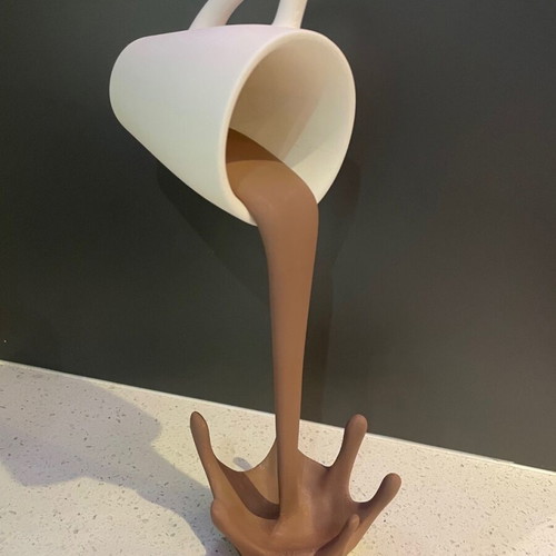 Decorative coffee cup that spills new