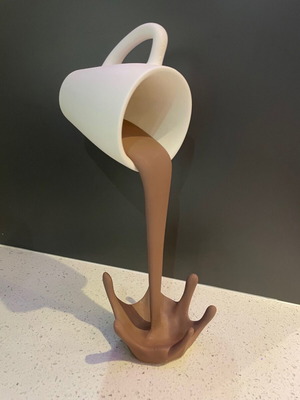Decorative coffee cup that spills new