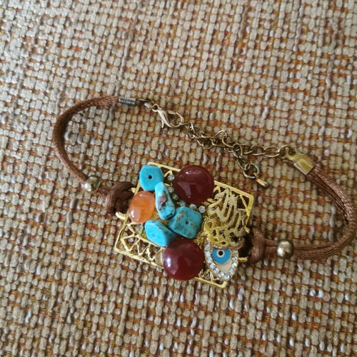 Women's bracelet like new with gold clasp and orange-blue stones