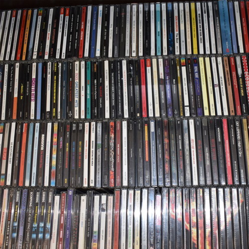 Music collection of 360 rock, pop, metal CDs, 29 music DVDs, 2 VHS tapes, with 2 CD shelves