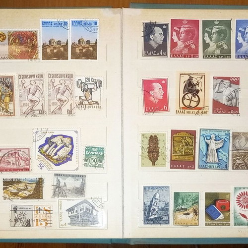 Book with collection of various Greek and foreign stamps used