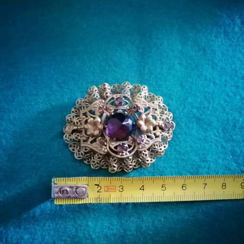 Vintage filigree brooch like new with central stone and rose crystals