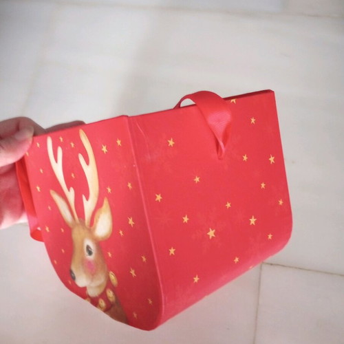Christmas basket new made of pressed paper with ribbon