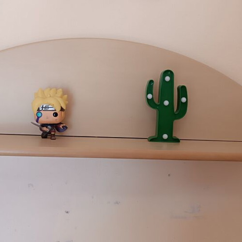 Wooden wall shelf with curved decorative back, for kids or teens