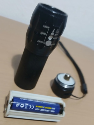 Flashlight with Adjustable Beam Used, Takes 3 AAA Batteries