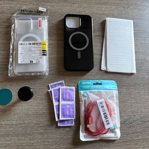 iPhone 16 Pro Max pack like new with cases, screen protectors, cable, and mount