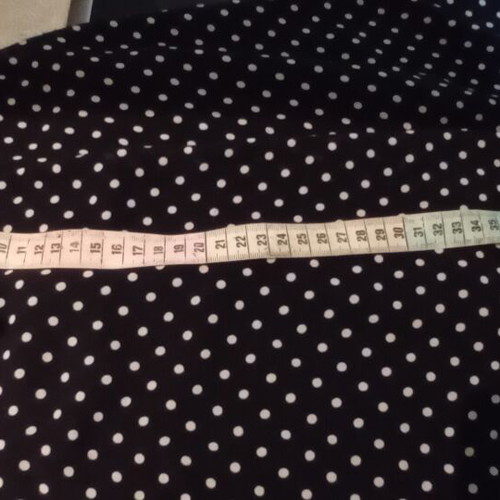 Black Short Skirt with White Polka Dot Pattern and Bow Tie, Like New
