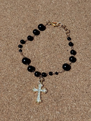 Bracelet with golden cross like new, black and gold