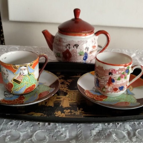 Decorative miniature tea set like new, fine porcelain
