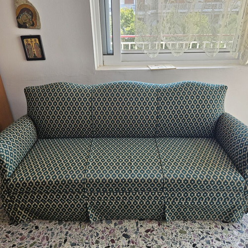 Elastic sofa cover for three-seater couch with fastening cords