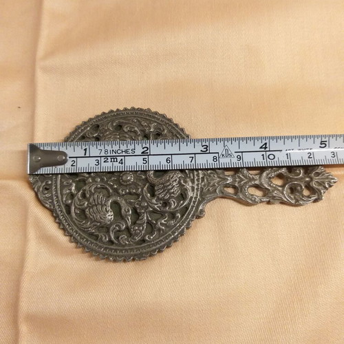 Carved old hand mirror used