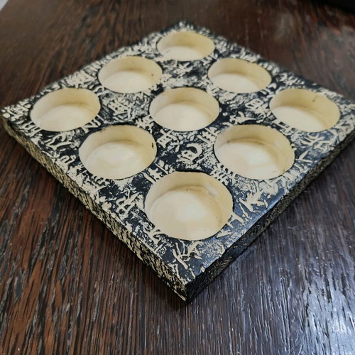 Stone base for 9 tealights like new with Asian designs
