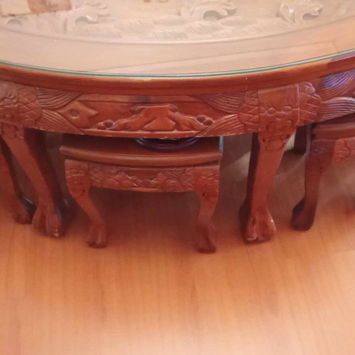 Coffee table with 6 small carved handmade stools like new, oval glass top