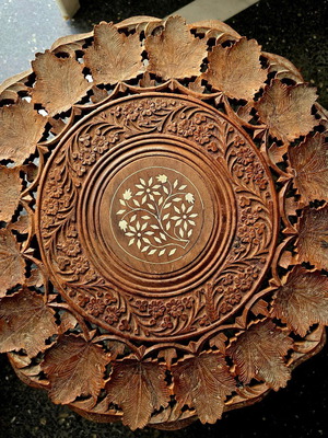 Carved coffee table used, 45cm height and 45cm diameter