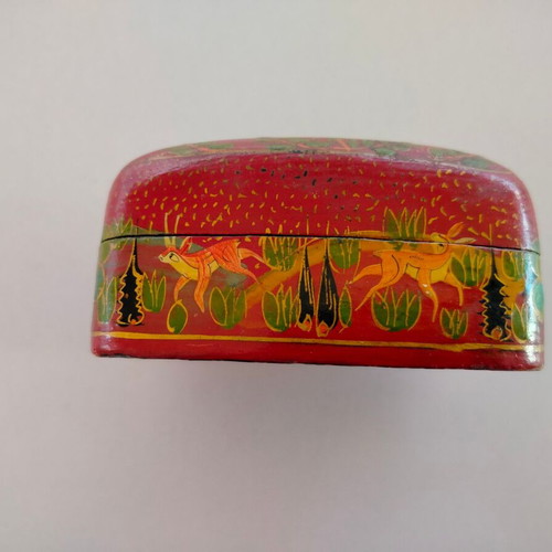 Decorative papier-mache box used with colorful patterns