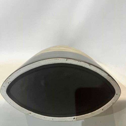 Modern ceramic conical vase with black and white striped design used